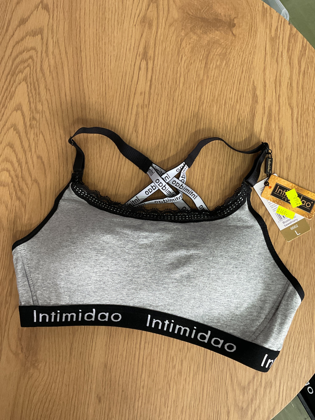 Dámská sportovní podprsenka šedá se zapínáním vel. L