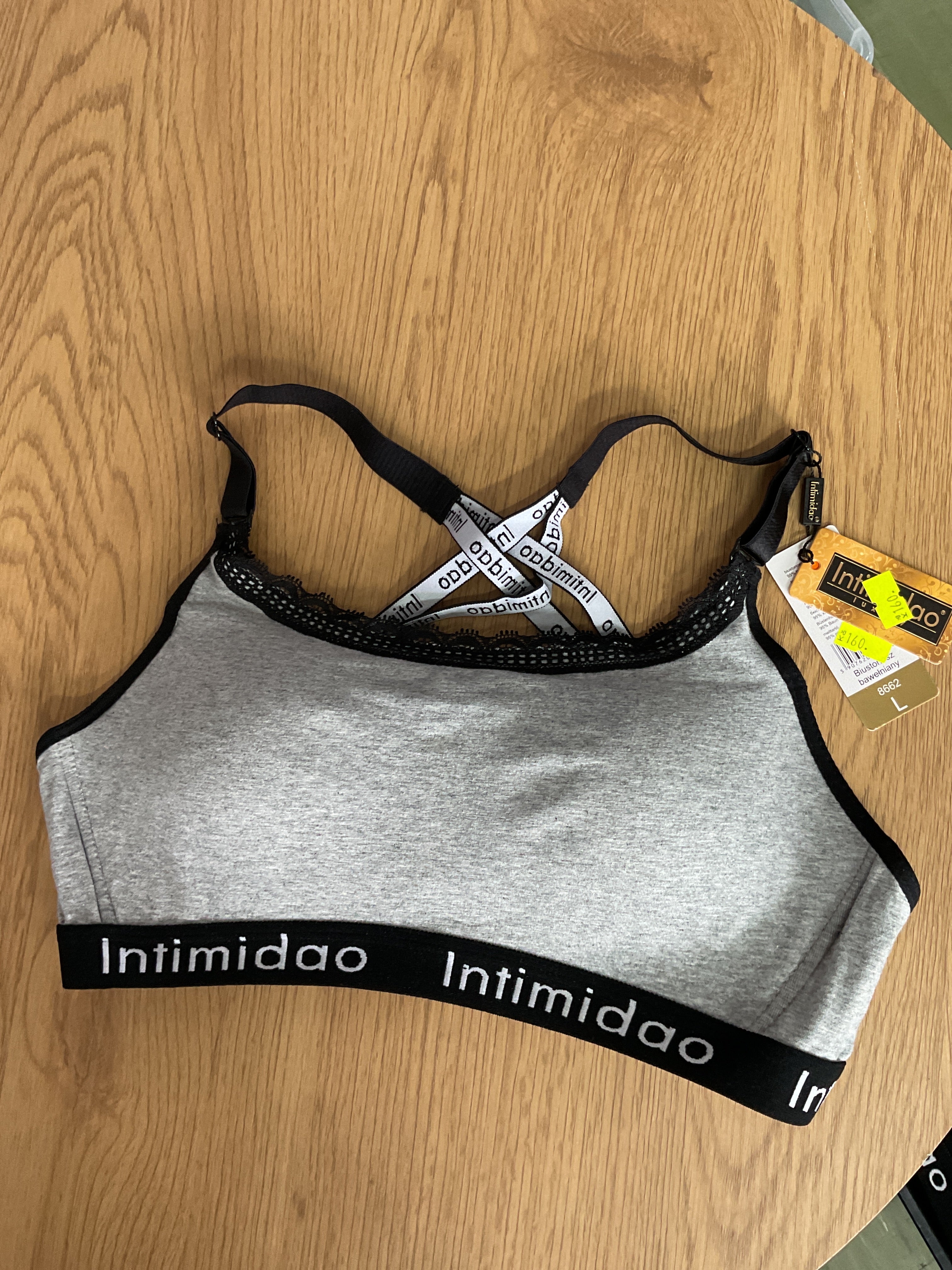 Dámská sportovní podprsenka šedá se zapínáním vel. L